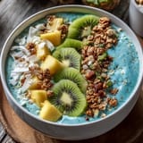 Creamy blue spirulina smoothie bowl, artistically topped for a beautiful breakfast moment.