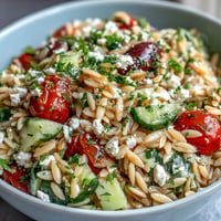 Bright orzo salad with cucumber, feta, and zesty lemon dressing, perfect for lunch.