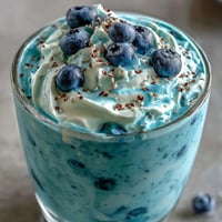 Creamy probiotic kefir smoothie with vibrant blueberries, breakfast ready.